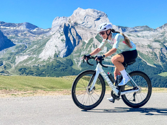 cyclist summiting col D'Aubisque on marmot tours atlantic to mediterranean cycling challenge