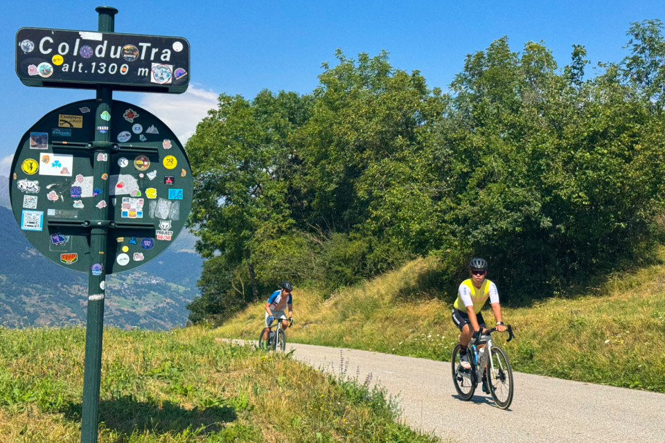 pair of cyclists summit col du tra on French alps cycling holiday with marmot tours