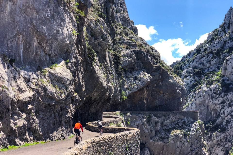 cyclists riding through gorge de galas on French pyrenees road cycling holiday with marmot tours